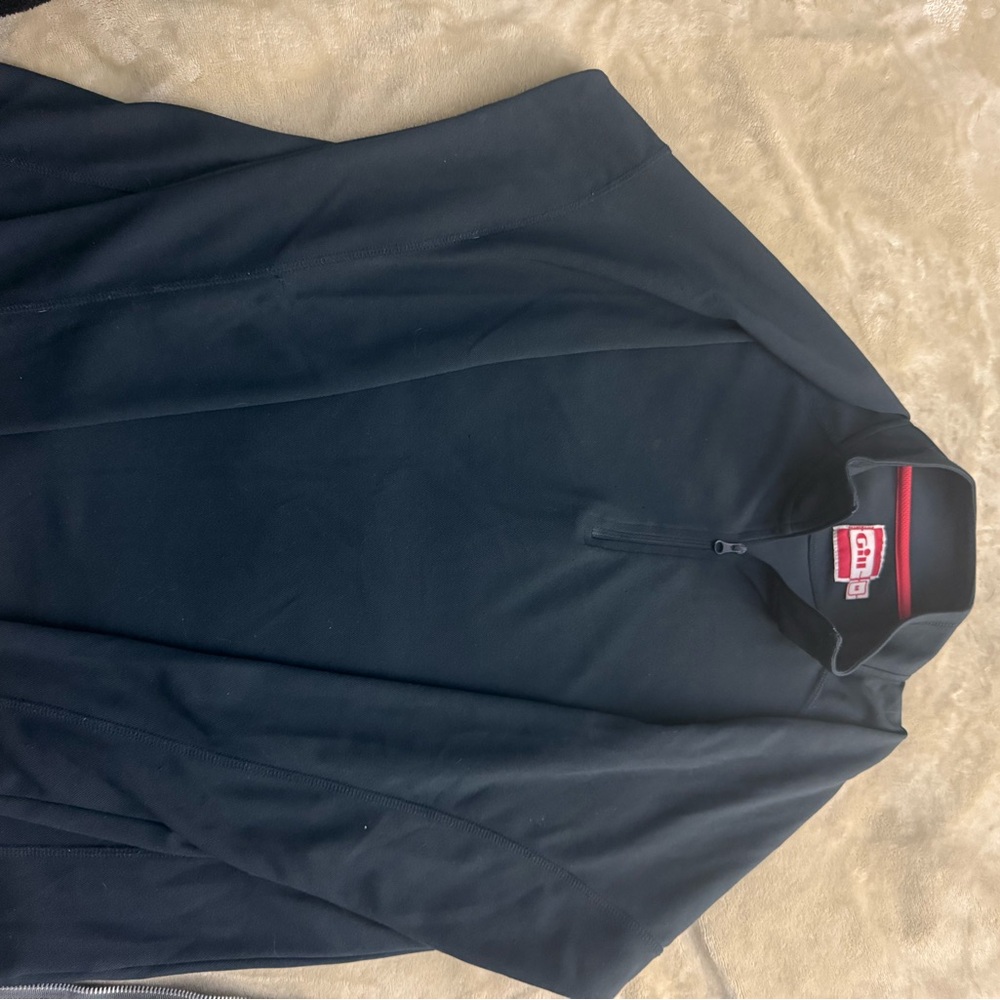 This is a black Gill quarter-zip fleece top.
